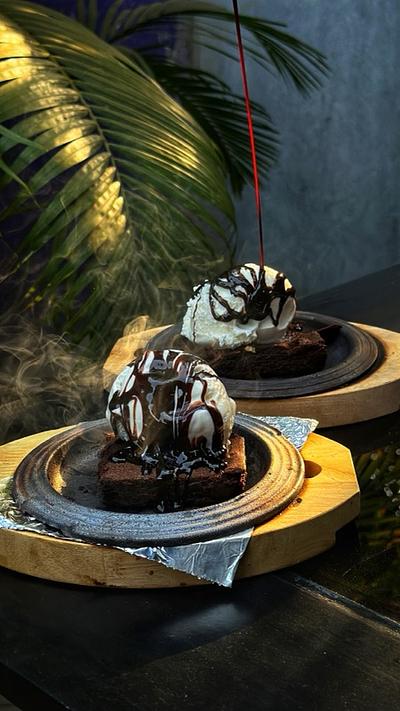 Flat photo of a sizzling brownie before AI video